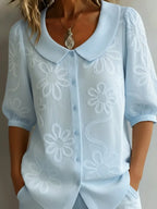 Vintage shirt with a stand-up collar and embroidered flowers