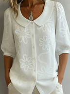 Vintage shirt with a stand-up collar and embroidered flowers